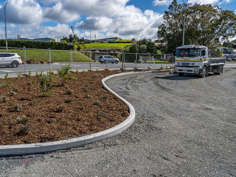 New kerb and planted island beside a Robinsons truck on a carpark job