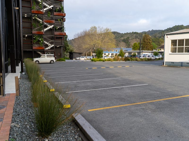 Line-marked commercial carpark with planted edges