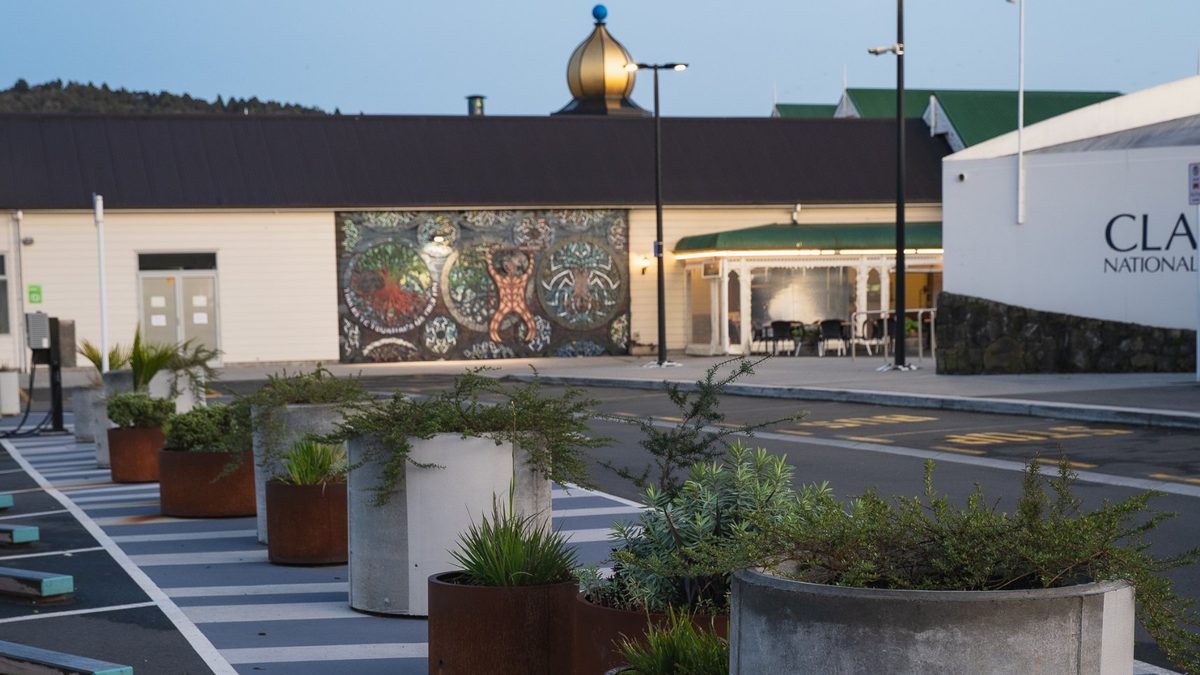 Planters, parking and lighting at the Town Basin Bus Facilities, Whangārei, at dusk