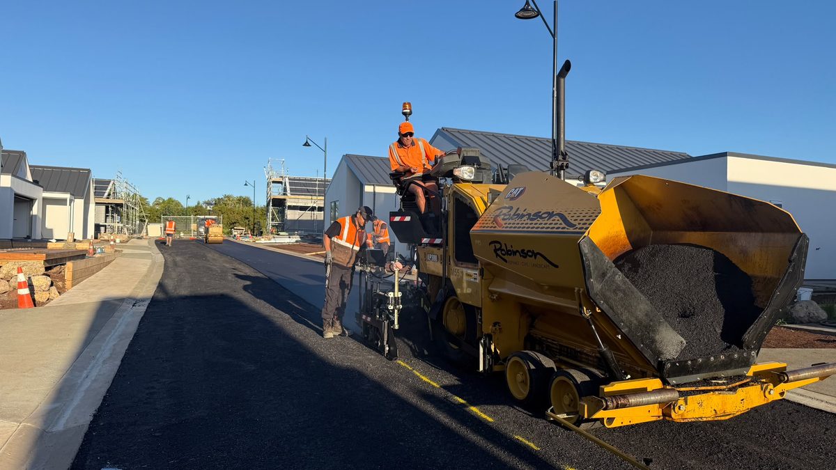 Robinsons paver laying hotmix on a new road at Ashbury Heights Retirement Village