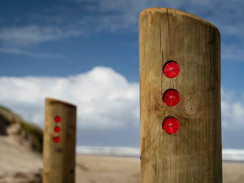 Timber bollards with reflectors at the Baylys Beach boardwalk
