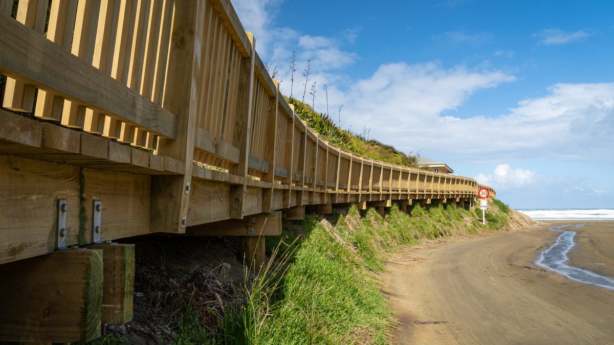 Baylys Beach boardwalk on its timber piles above the beach